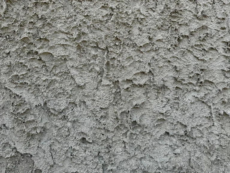 Close-up of a cracked cement exterior wall