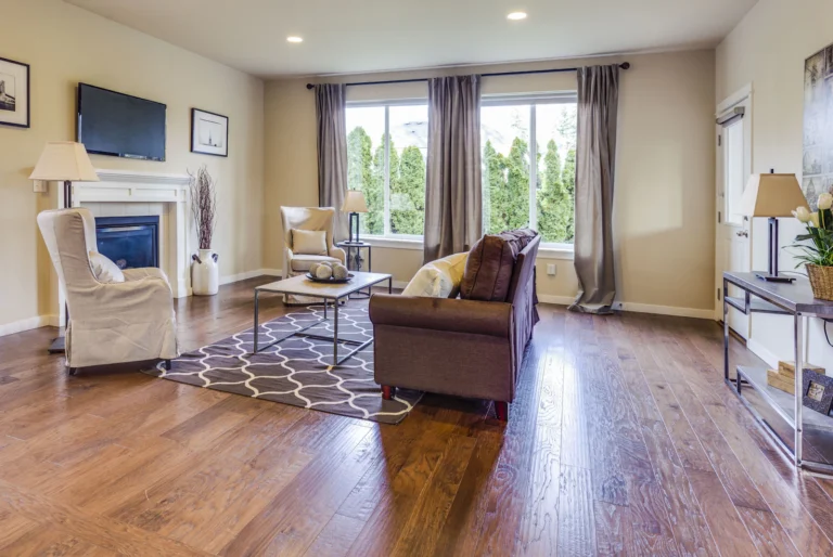 Living room with warm hardwood flooring and a fireplace